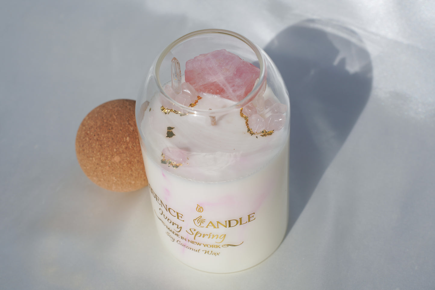 Ivory Spring 27oz hand-poured candle in an elegant glass jar with cork lid, crafted from eco-friendly soy and coconut wax, offering a luxury gift experience and long burn time.