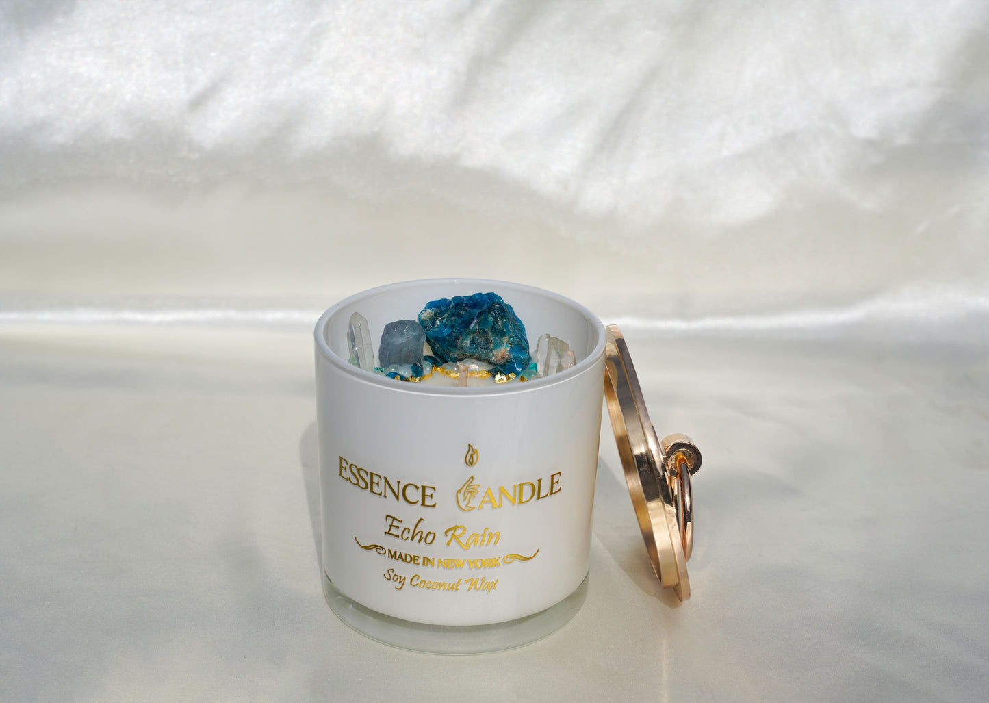 Echo Rain 18.5oz hand-poured candle in a frosted glass jar with gold stainless steel lid, crafted from eco-friendly soy and coconut wax, offering a luxury gift experience and long burn time.