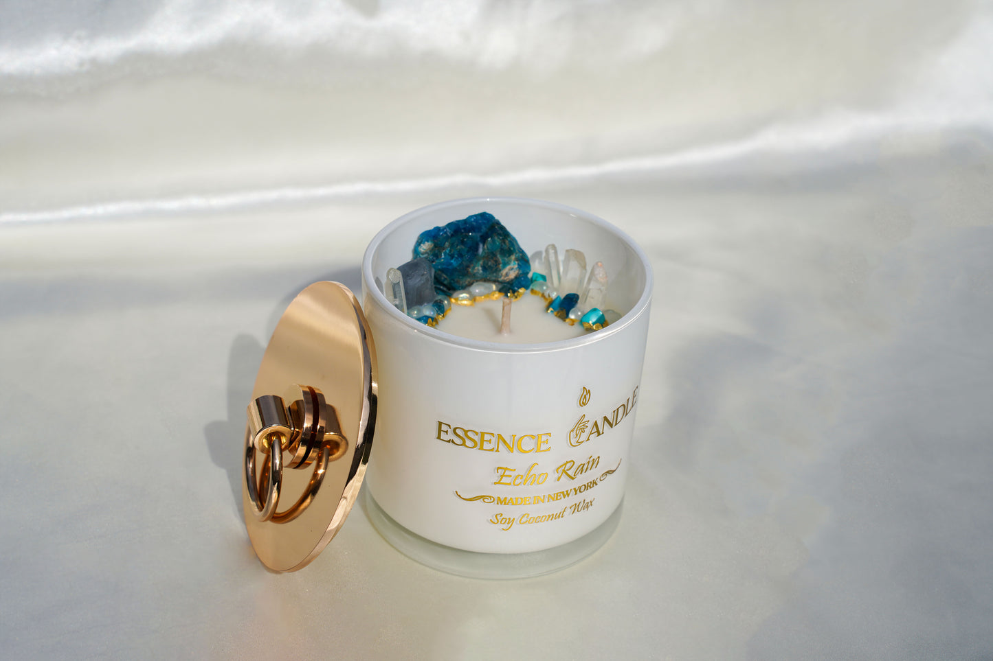 Hand-poured 18.5oz Echo Rain candle in frosted glass jar with gold stainless steel lid, a sophisticated eco-friendly luxury gift featuring soy and coconut wax and an exceptionally long burn time.