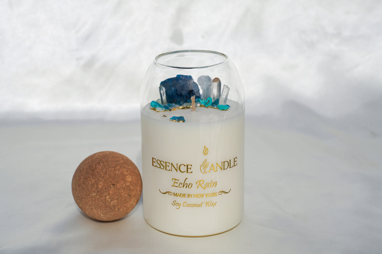 Echo Rain 27oz hand-poured candle in an elegant glass jar with cork lid, crafted from eco-friendly soy and coconut wax, offering a luxury gift experience and long burn time.