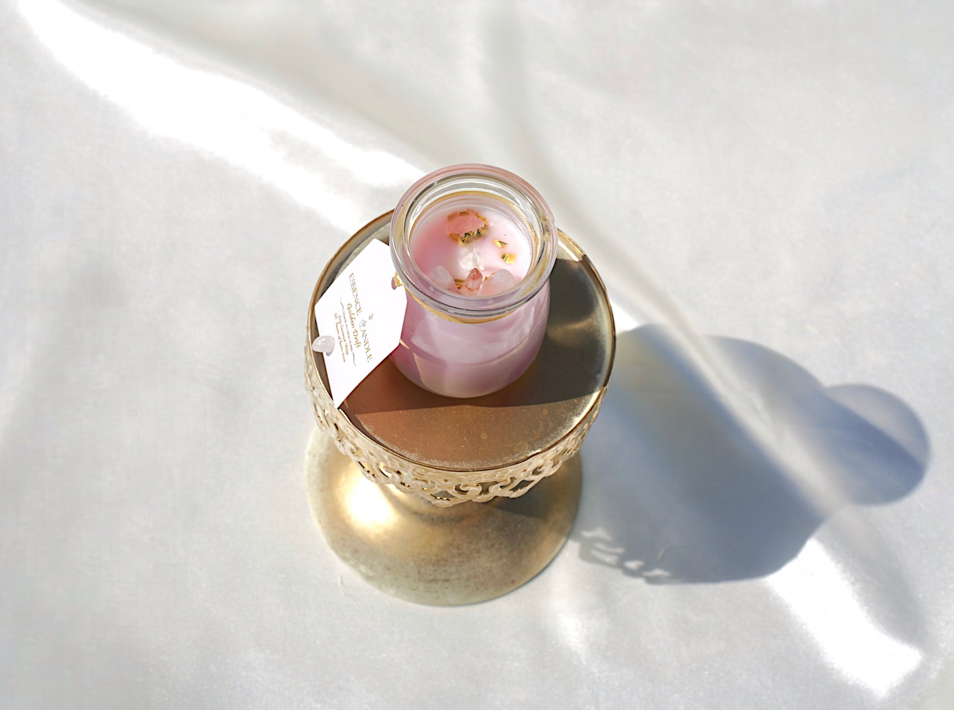 Eco-friendly Ivory Spring 4 oz crystal candle with ylang ylang fragrance, rose quartz for compassion, clear quartz for focus, soy coconut wax blend.