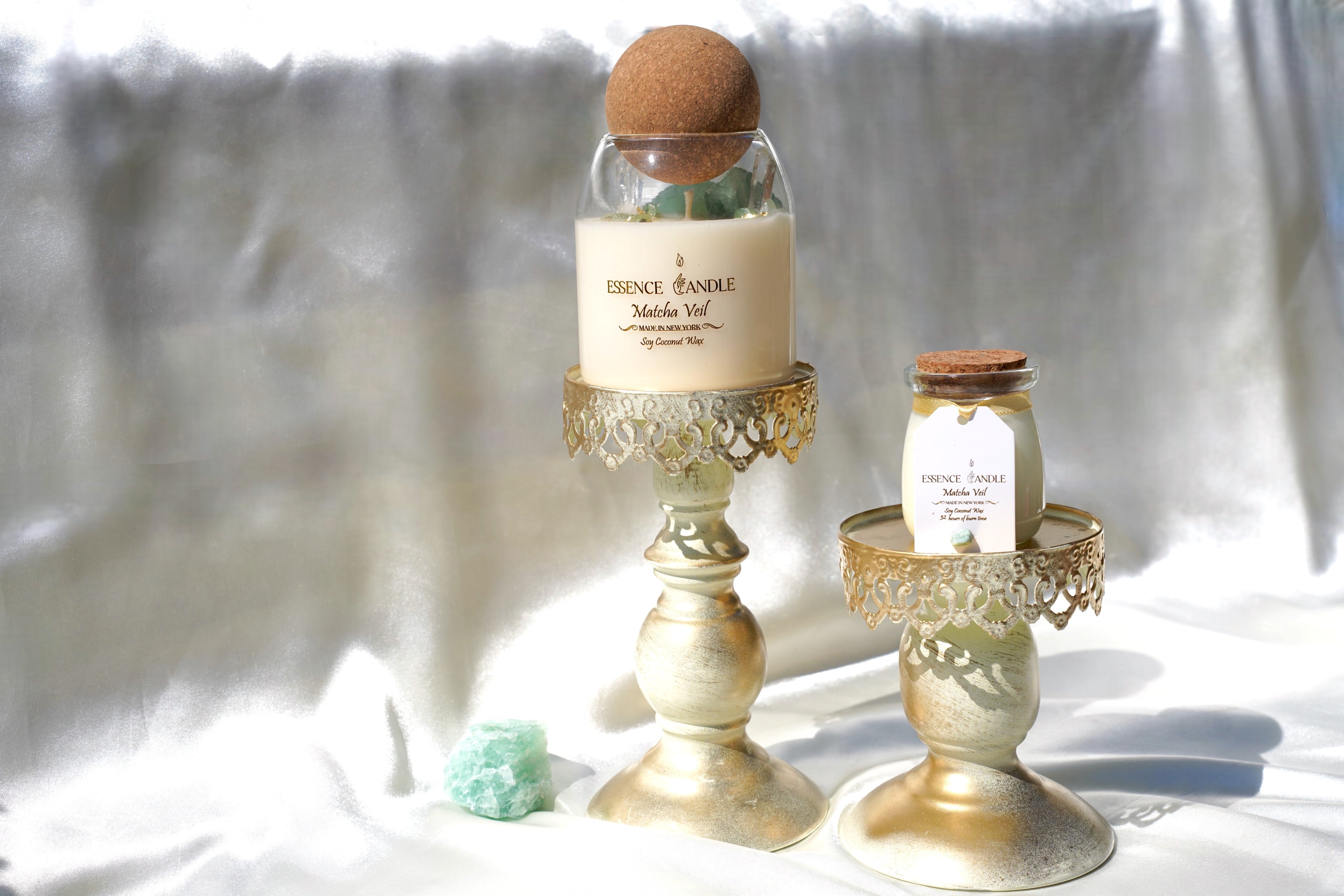 Green fluorite and aventurine crystal details inside Matcha Veil candle, healing energy crystal candle with clear quartz and gold accents, luxury home fragrance.