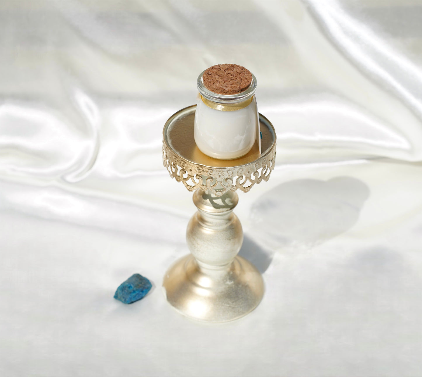 Luxury Echo Rain candle, 4 oz jar with rainforest aroma, turquoise howlite, rainbow aura quartz, and gold detailing, artisan-poured in New York.