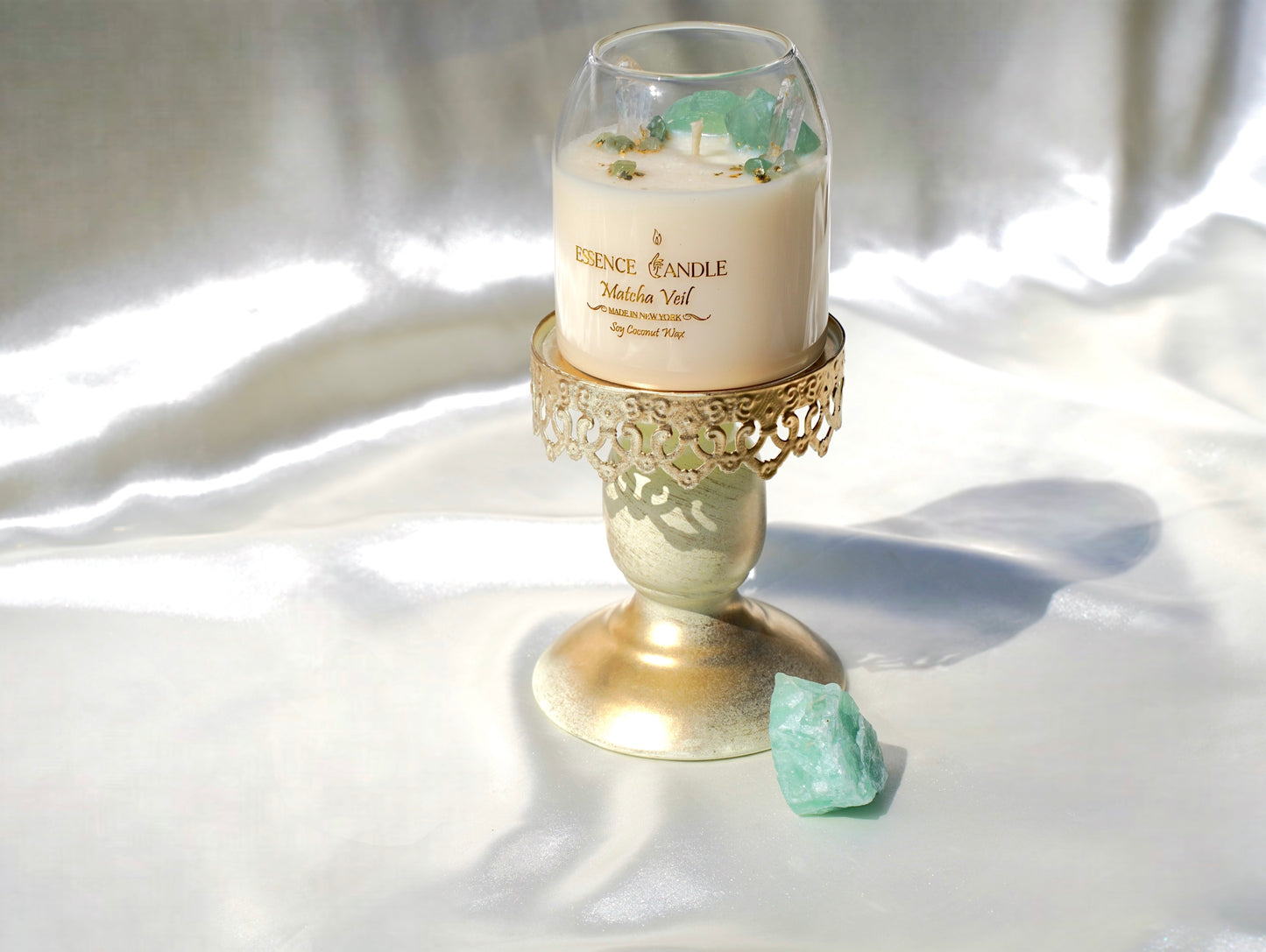 Healing crystal candle infused with green fluorite and aventurine stones, long burn soy coconut wax with gold flakes, sustainable handmade luxury candle.