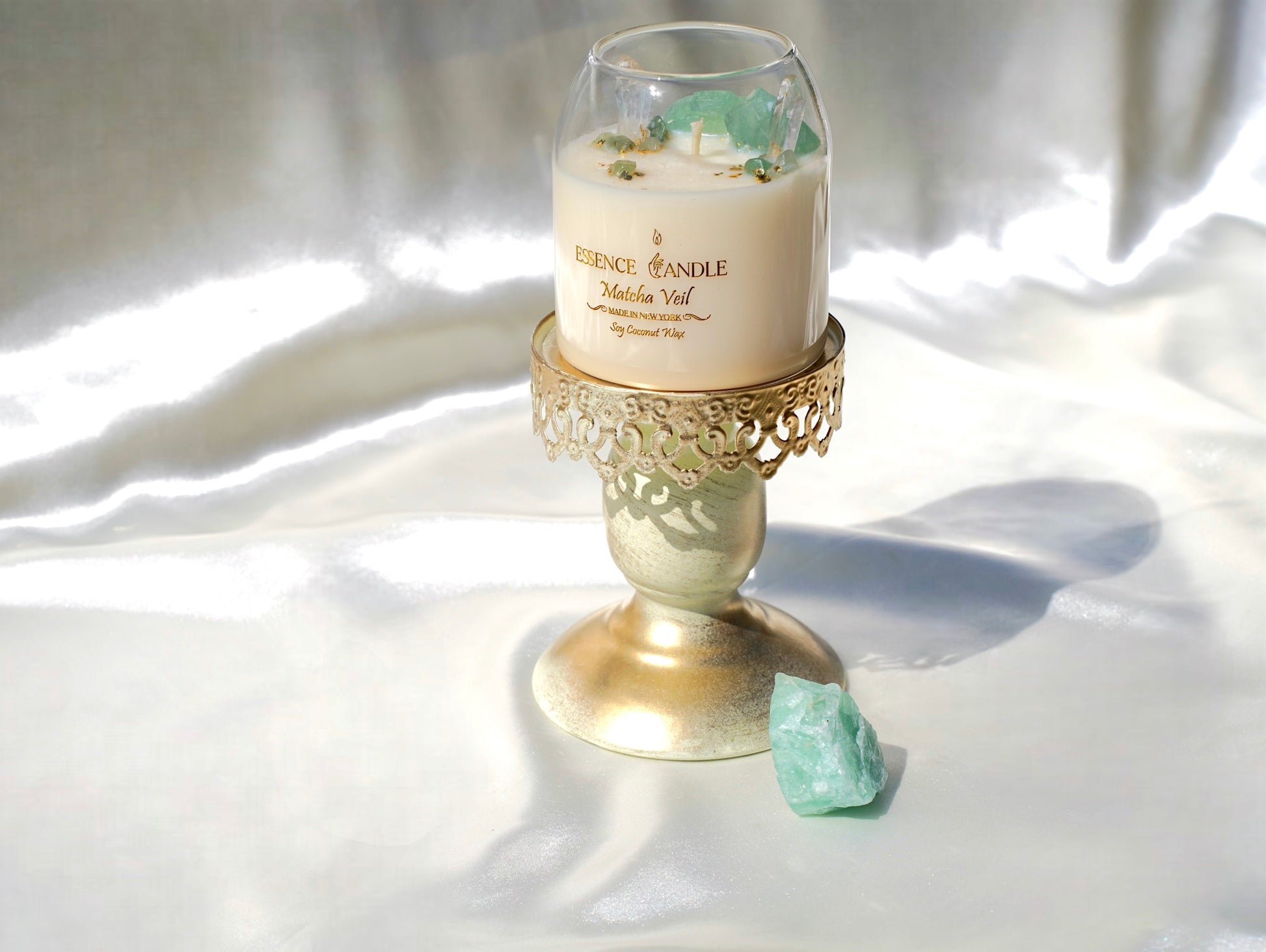 Healing crystal candle infused with green fluorite and aventurine stones, long burn soy coconut wax with gold flakes, sustainable handmade luxury candle.