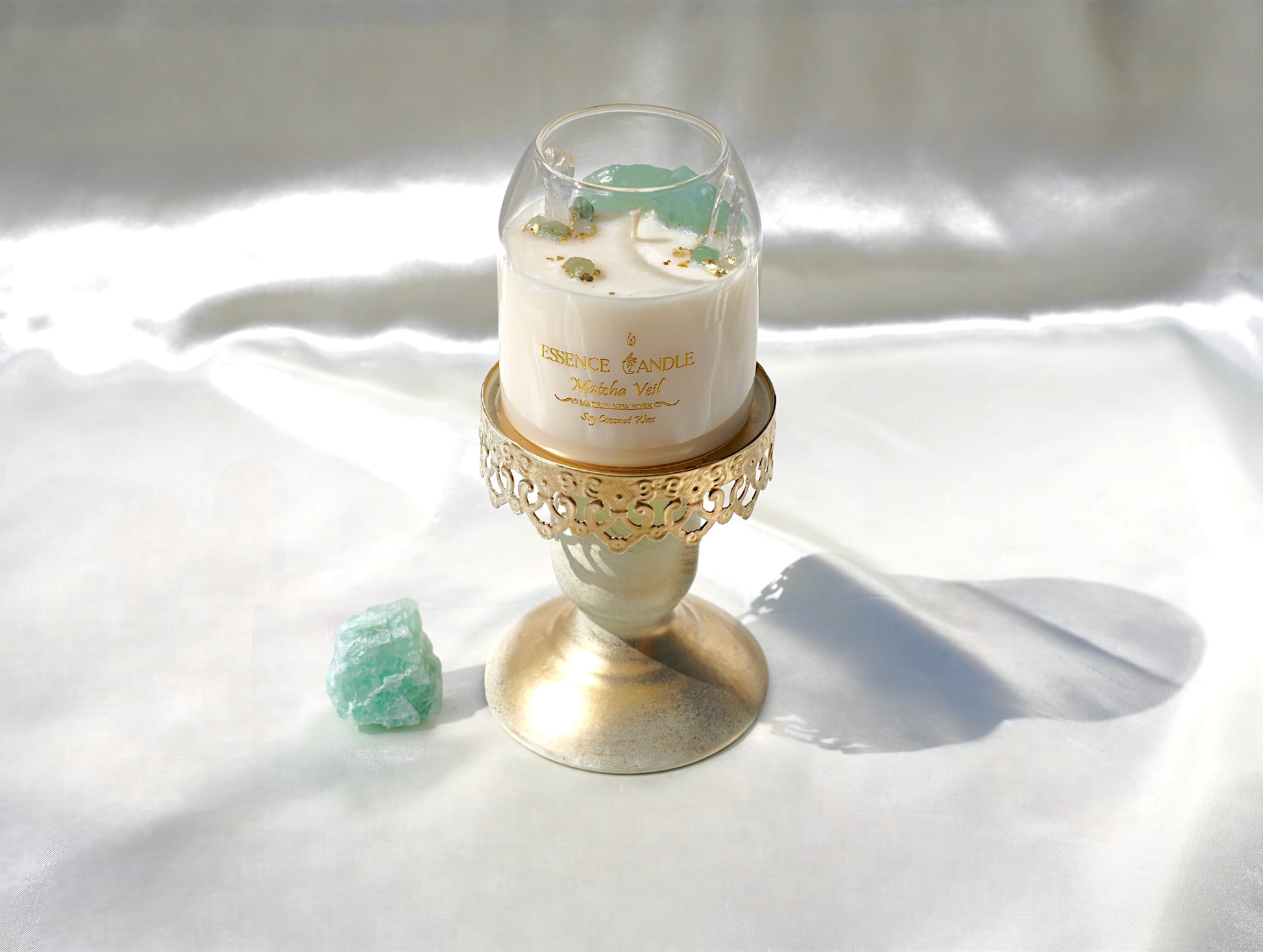 Healing crystal candle infused with green fluorite and aventurine stones, long burn soy coconut wax with gold flakes, sustainable handmade luxury candle.