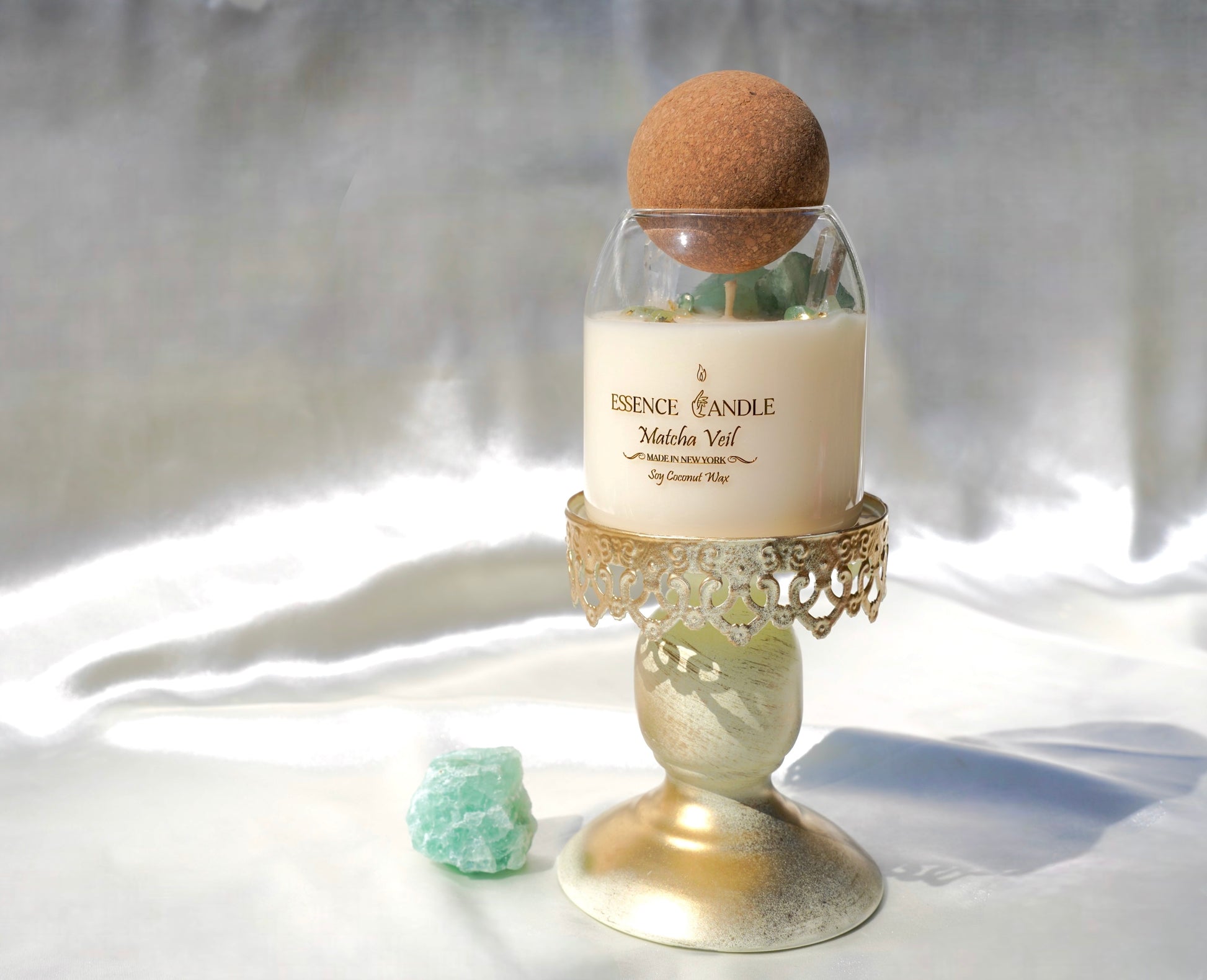 Matcha Veil luxury crystal candle featuring green fluorite, aventurine, and clear quartz in a glass jar, crafted with eco-friendly soy coconut wax and gold detailing, handmade in New York.
